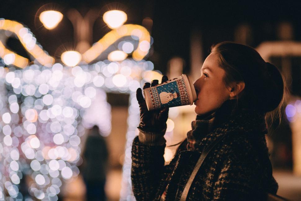Free Image of Woman Drinking a Cup of Coffee at Night 