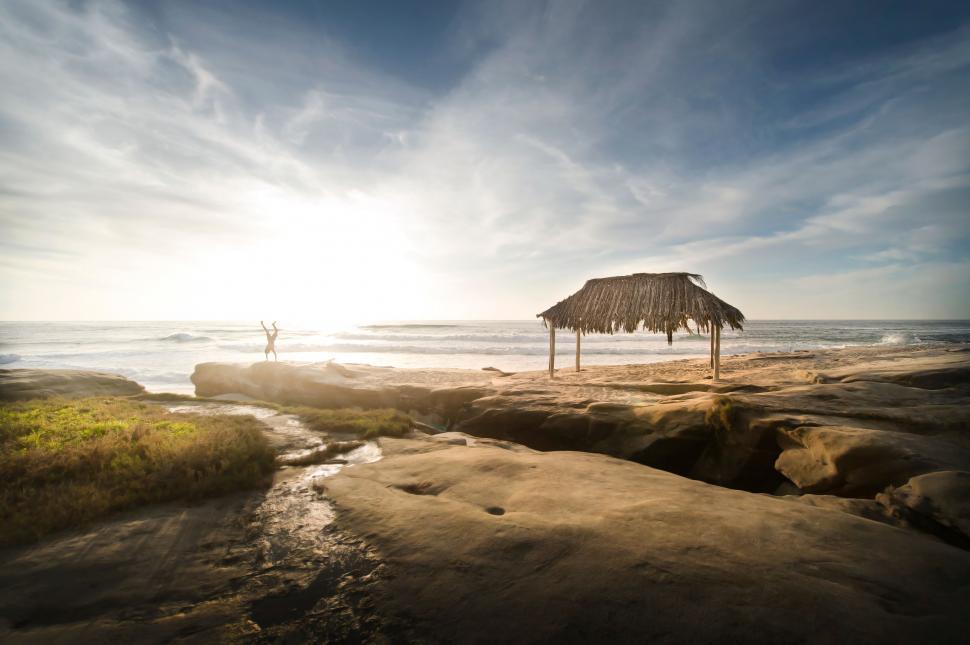 Free Image of Hut on Sandy Beach by Ocean 