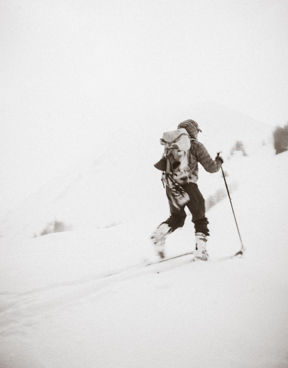 Free Image of Man Skiing Down Snow Covered Slope 