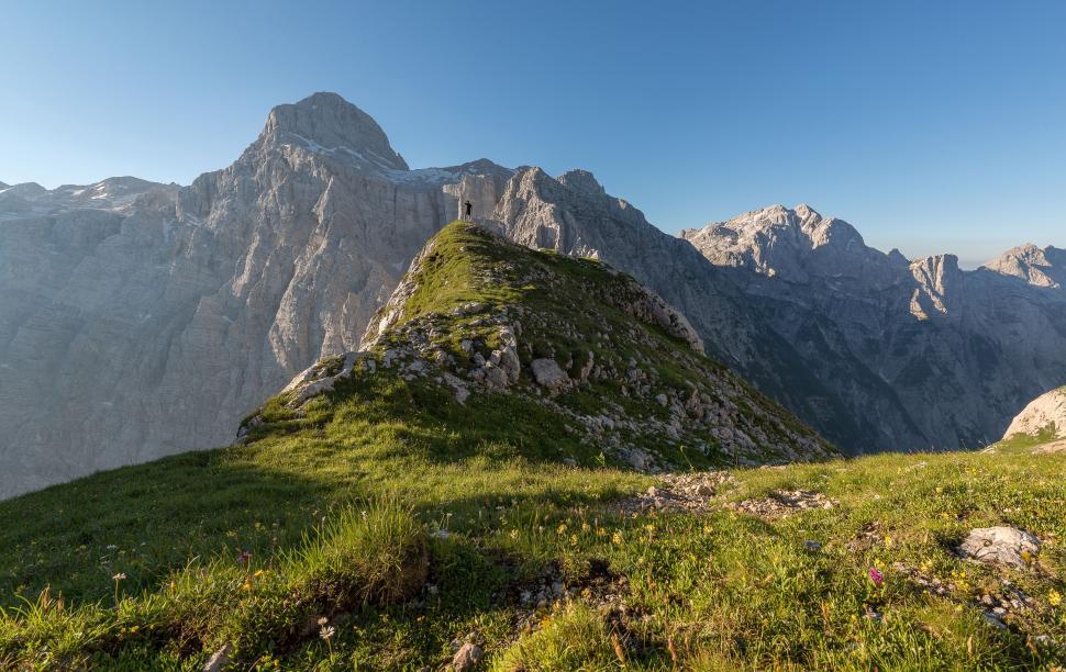Free Image of Grassy Hill With Small Tower 