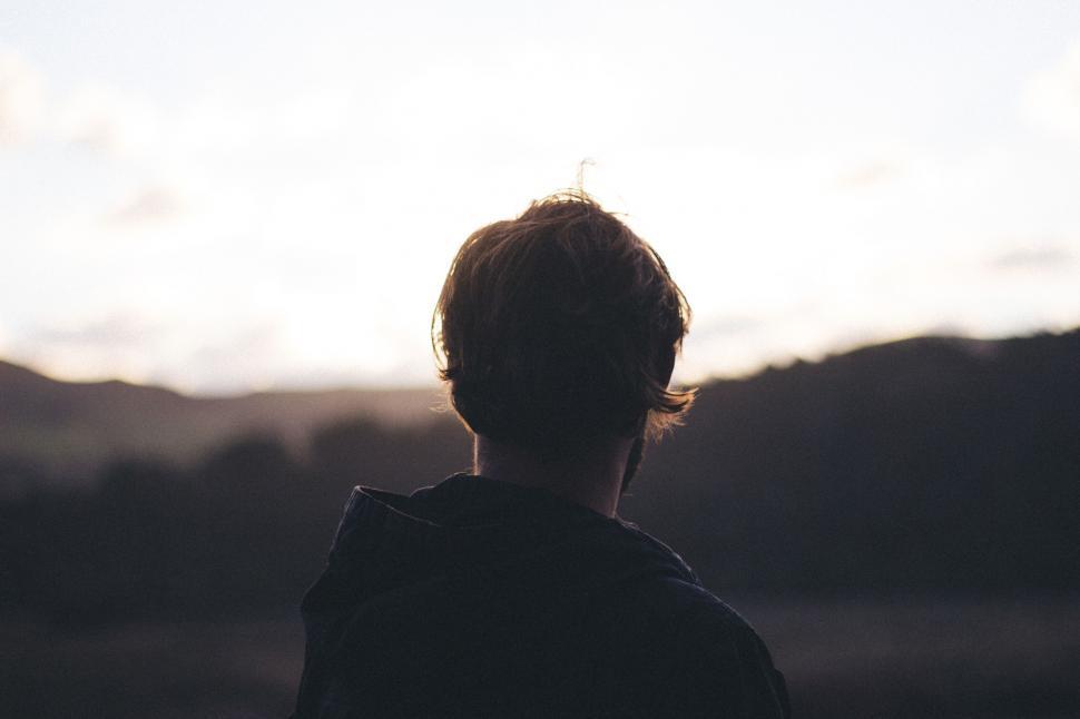 Free Image of Person Standing in Front of Mountain 