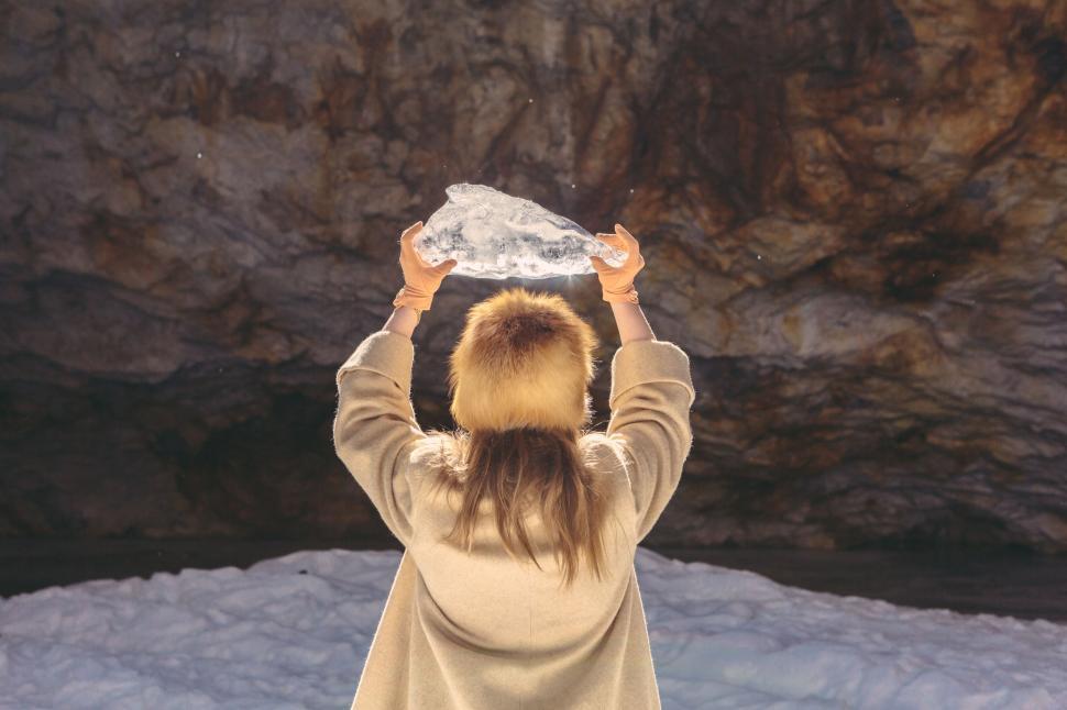 Free Image of Woman Standing in Snow Holding Snowball 