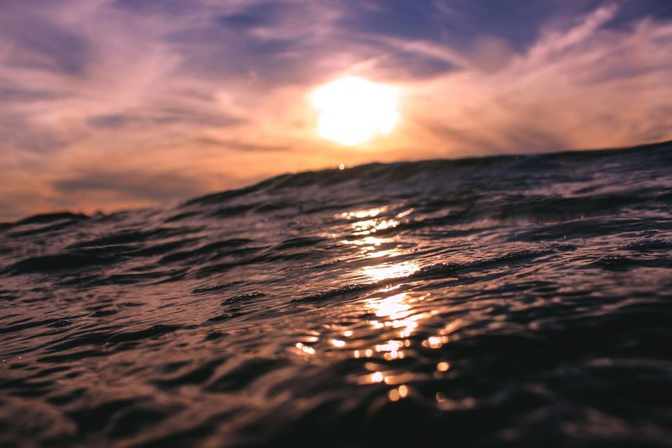 Free Stock Photo of Sun Shining Through Clouds Over Ocean 