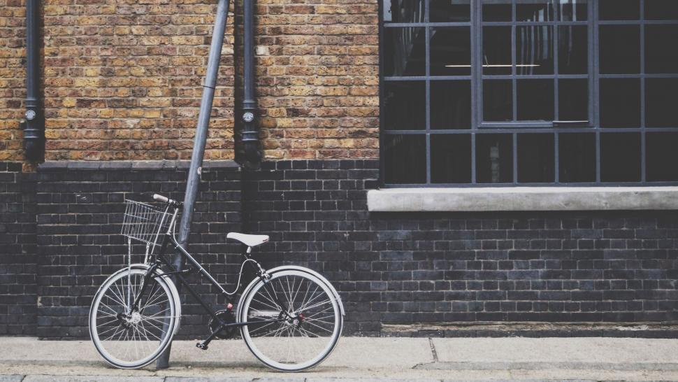 Free Image of Bicycle Parked on Side of Street 