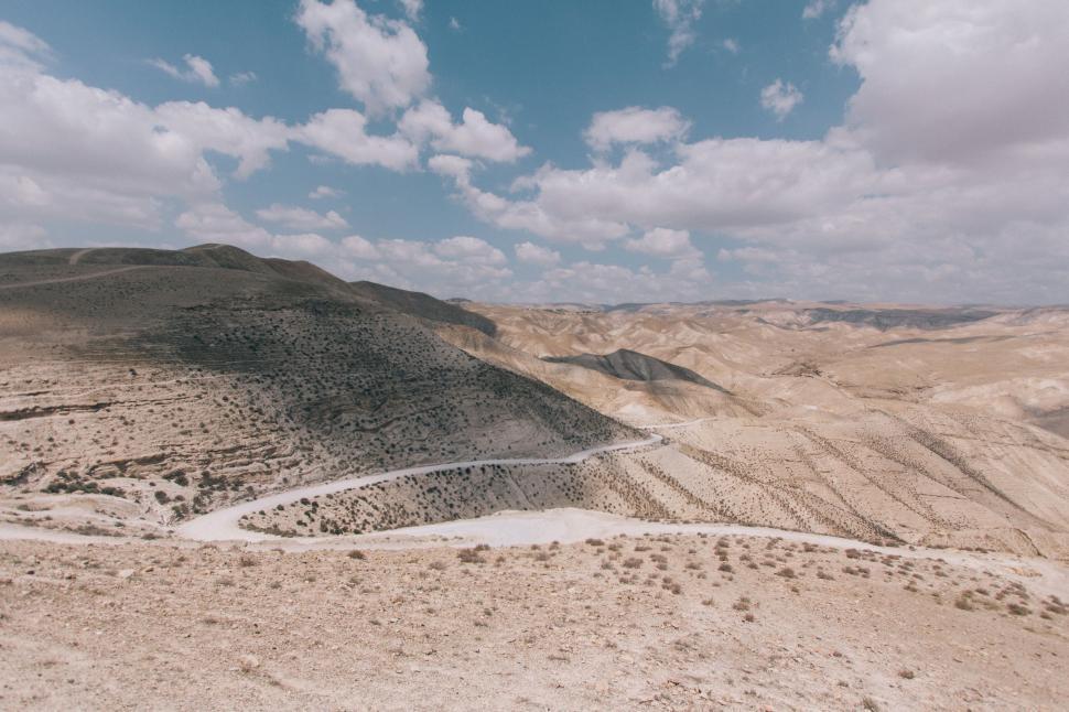 Free Image of Vast Desert Landscape With Cloudy Sky 