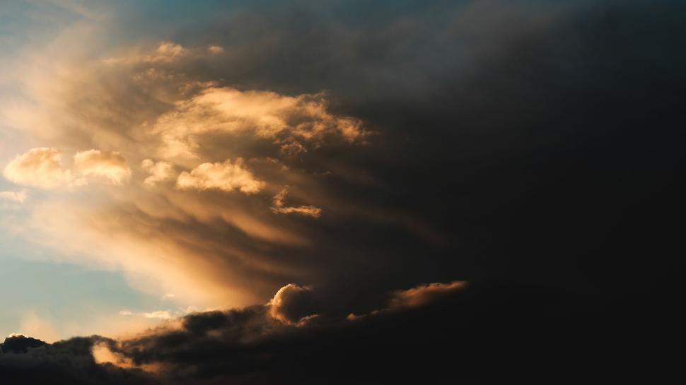 Free Image of Plane Flying Through Cloudy Blue Sky 