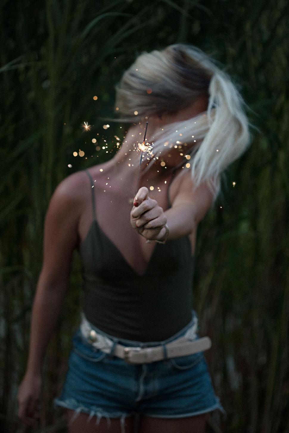 Free Image of Woman Blowing Bubbles in Tank Top 