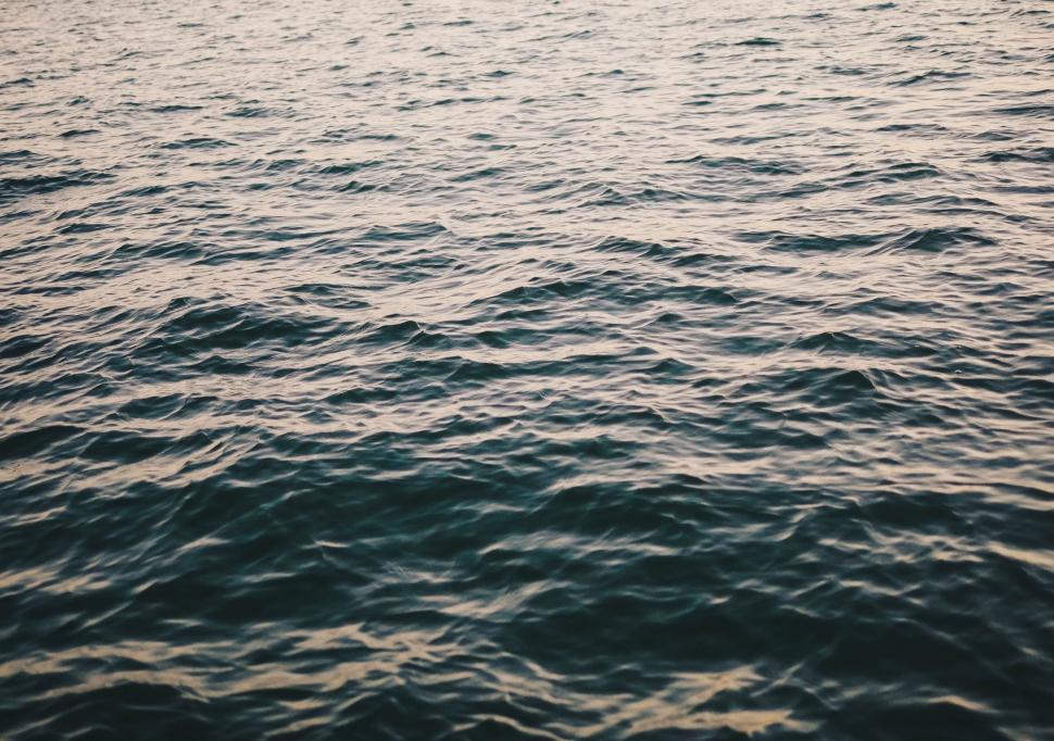 Free Image of Boat Sailing Across Vast Water 