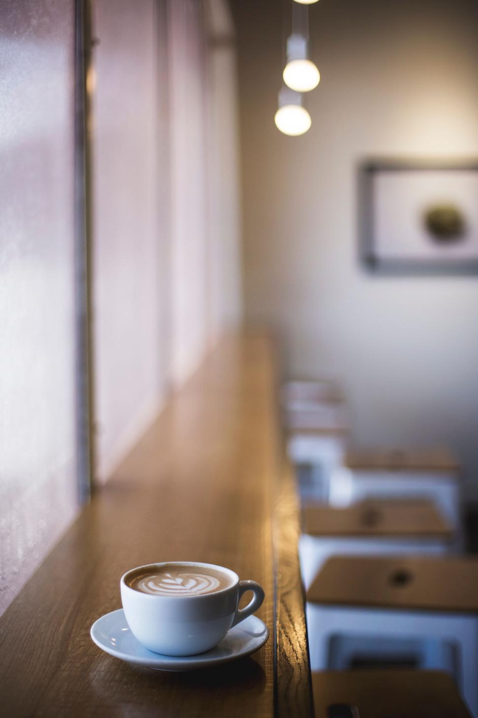 Free Image of A Cup of Coffee on a Wooden Table 