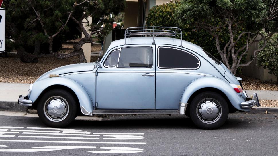 Free Image of A Blue Car Parked on the Side of the Road 