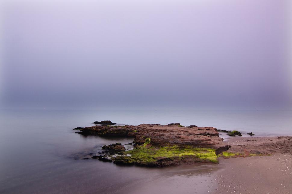 Free Image of Small Island in the Middle of Body of Water 