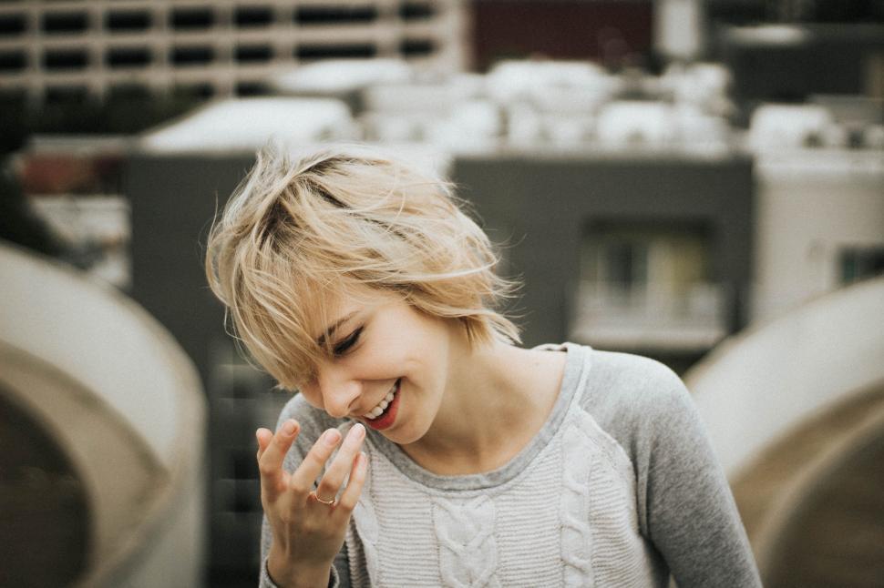Free Image of Woman Standing in Front of Pipes 