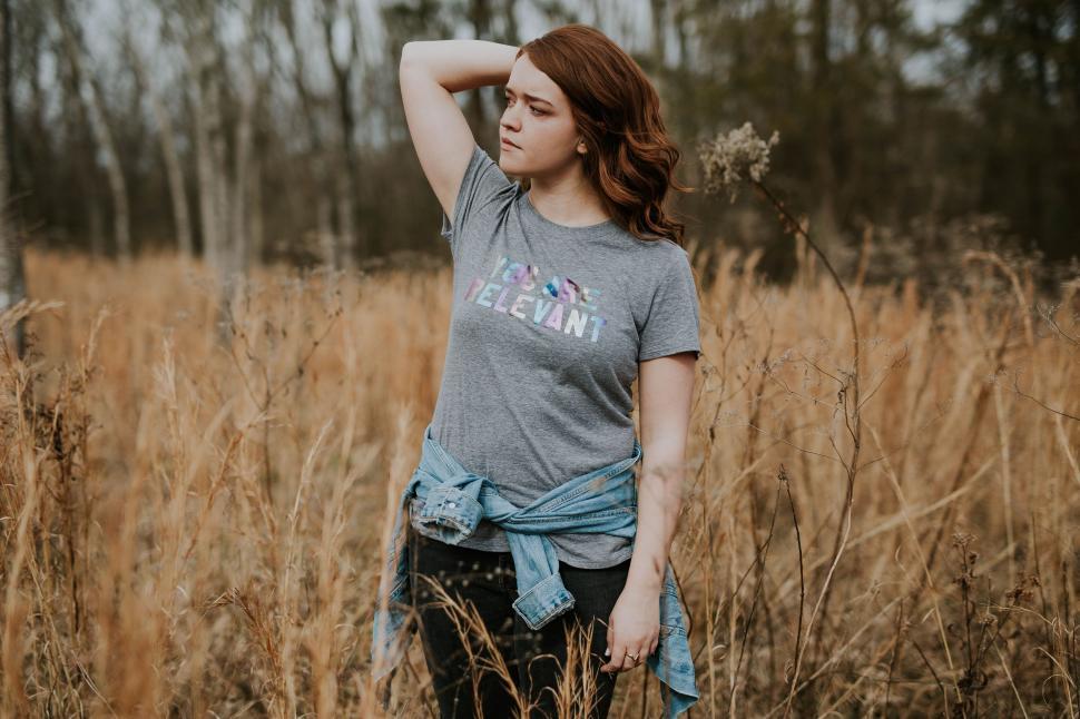Free Image of Woman Standing in Field of Tall Grass 