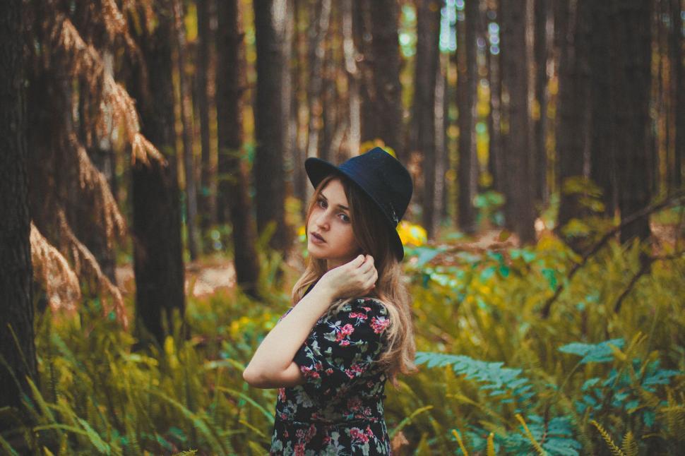 Free Image of Woman Standing in Middle of Forest 
