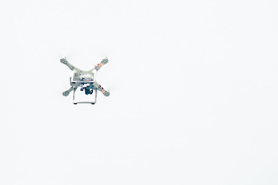 Free Image of Small Propeller Plane Flying in White Sky 