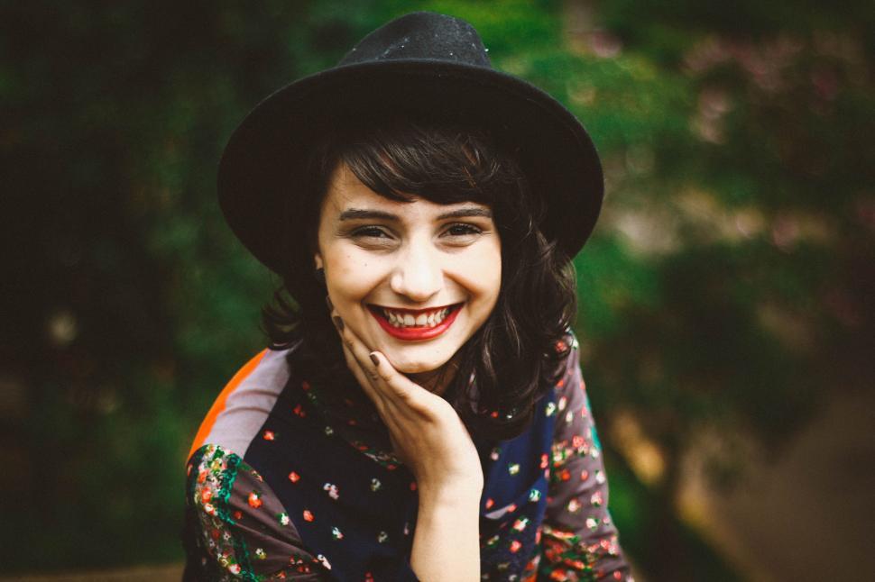 Free Image of Woman Wearing Black Hat and Smiling 