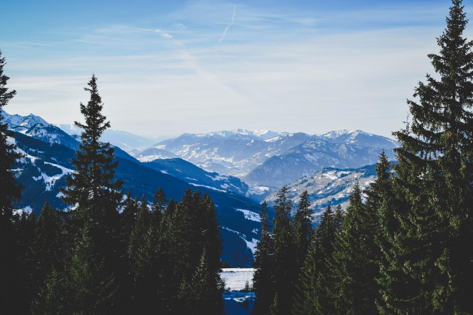 Free Image of Snowboarder Descending Snowy Hill 