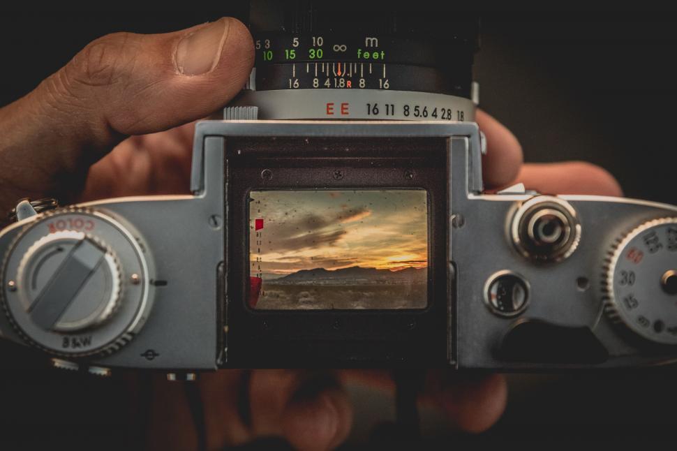 Free Image of Person Holding Camera in Hands 