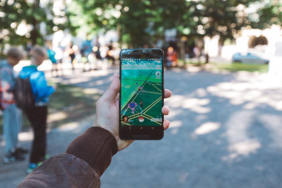 Free Image of Person Holding Up Cell Phone to Take Picture 