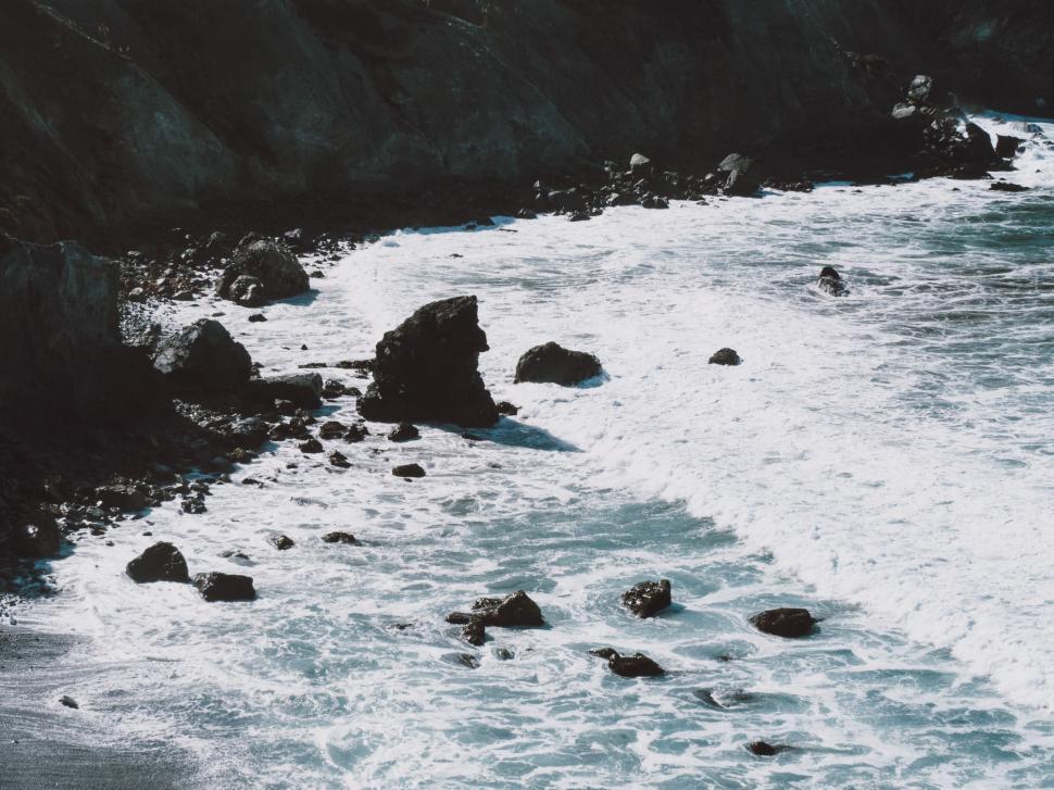 Free Image of Ocean Waves Crashing Against Coastal Rocks 
