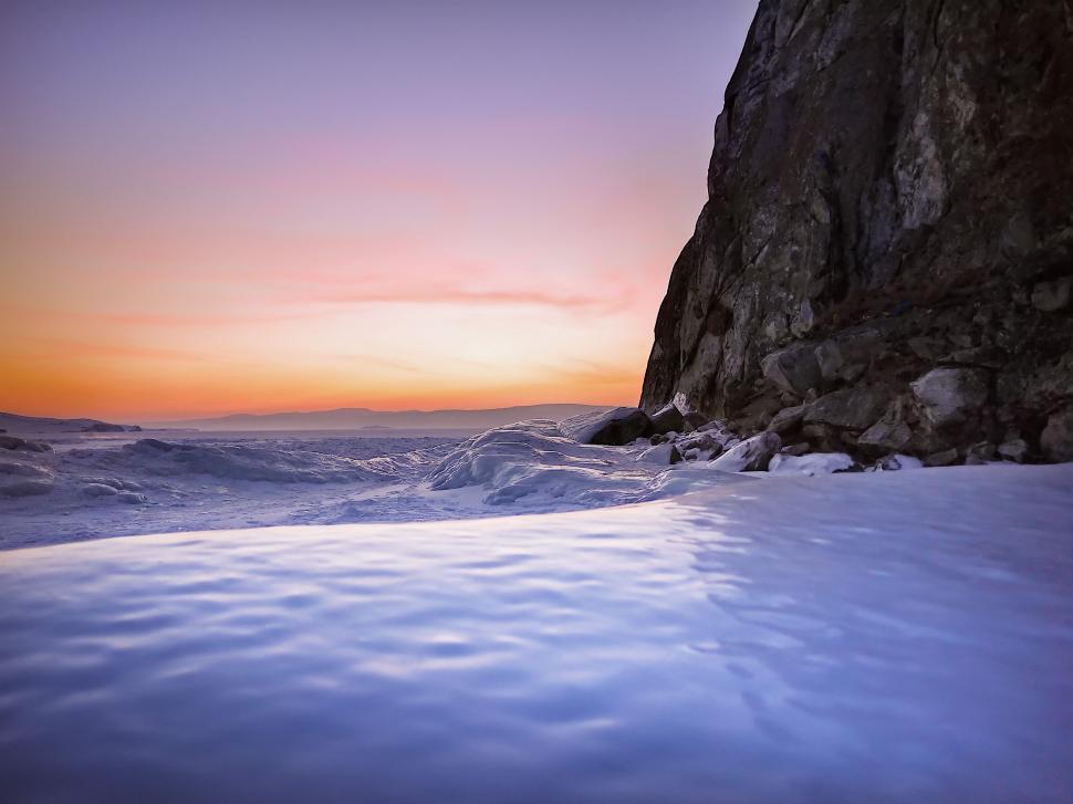 Free Image of Large Rock in Middle of Body of Water 