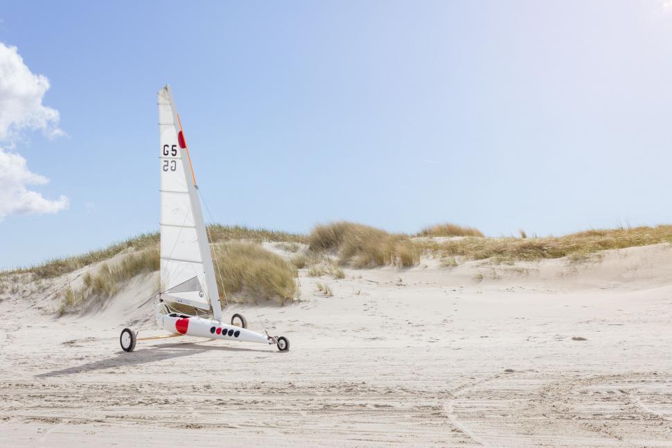 Free Image of Catamaran Sailing on Sandy Beach 