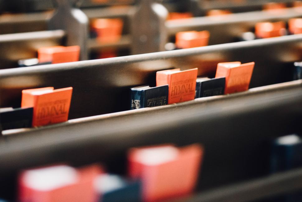 Free Image of Rows of Chairs With Orange and Black Seats 
