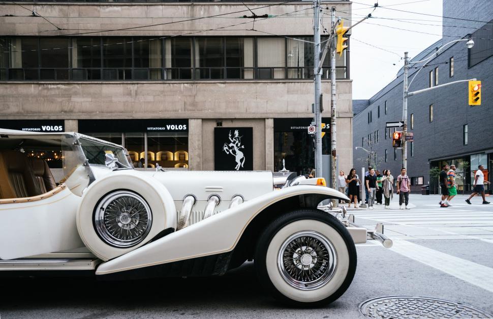 Free Image of White Car Parked on Side of Road 