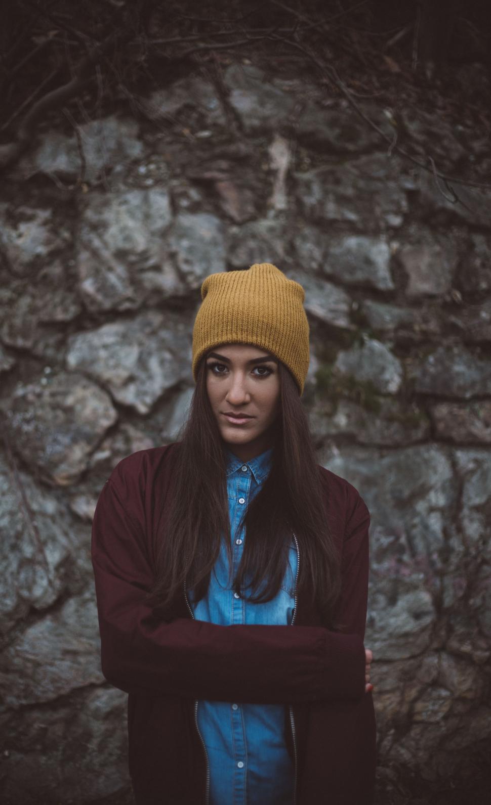 Free Image of Woman With Long Hair Wearing a Yellow Hat 