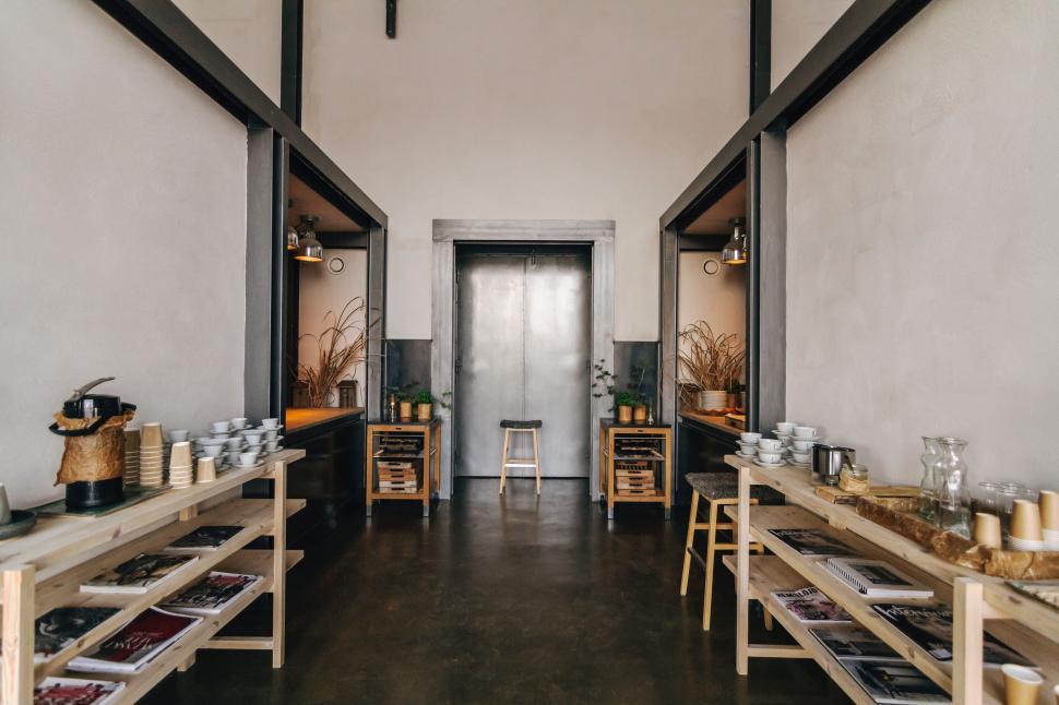 Free Image of Room Filled With Wooden Shelves Holding Various Items 