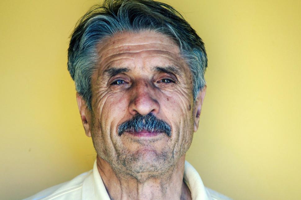 Free Image of Man With Mustache in White Shirt 