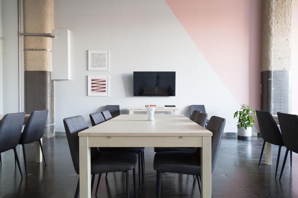 Free Image of White Table With Black Chairs in a Room 