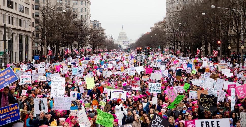 large-group-of-people-holding-up-signs.jpg