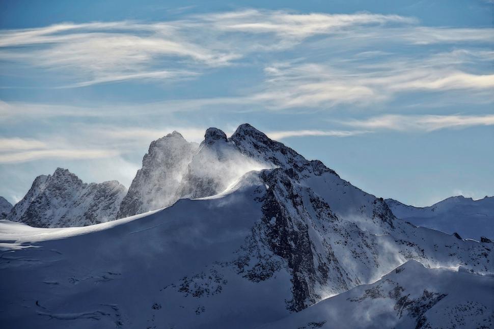 Free Image of Snow-Covered Mountain Under Blue Sky 