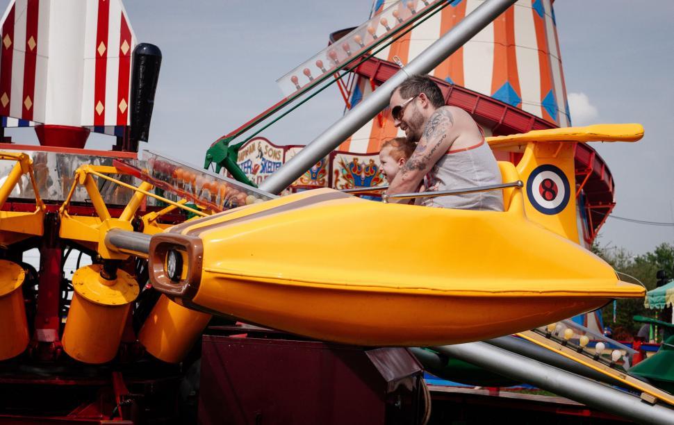 Free Image of Man Riding on Back of Yellow Boat 