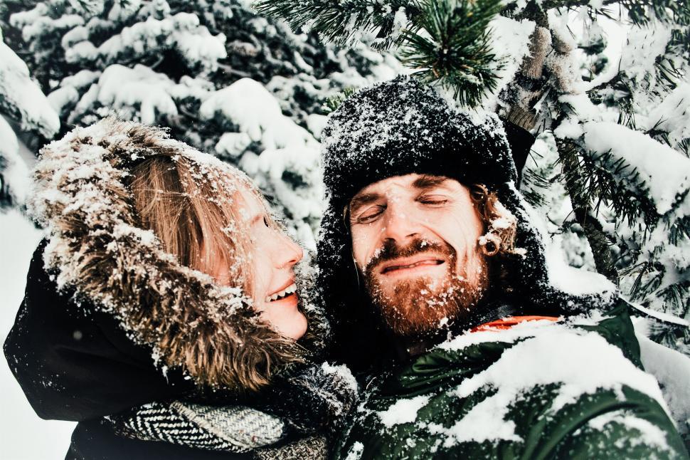 Free Image of A Man and a Woman Walking in the Snow 