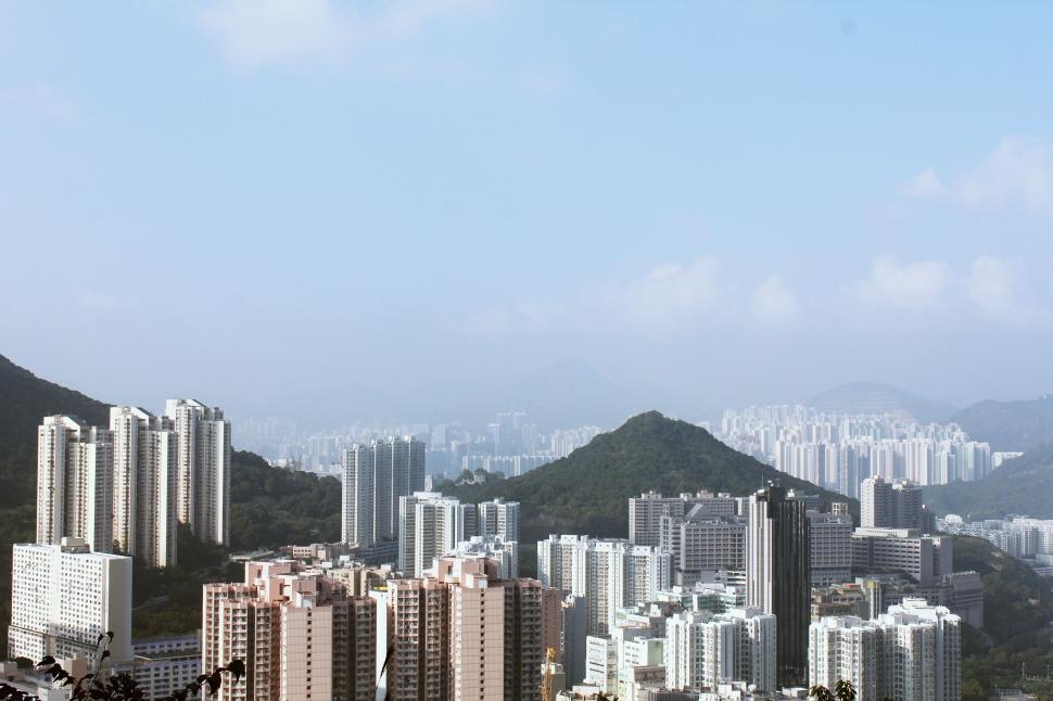 Free Image of City Skyline With Majestic Mountain Background 