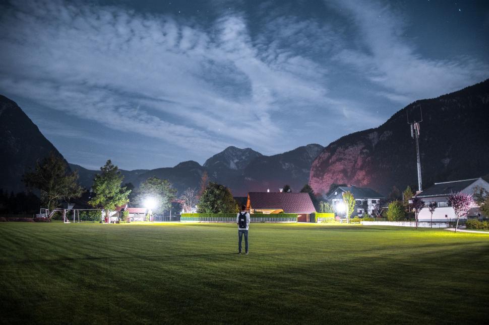 Free Image of Person Standing in Field at Night 
