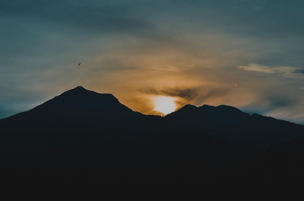 Free Image of Sun Setting Behind Mountain Range 