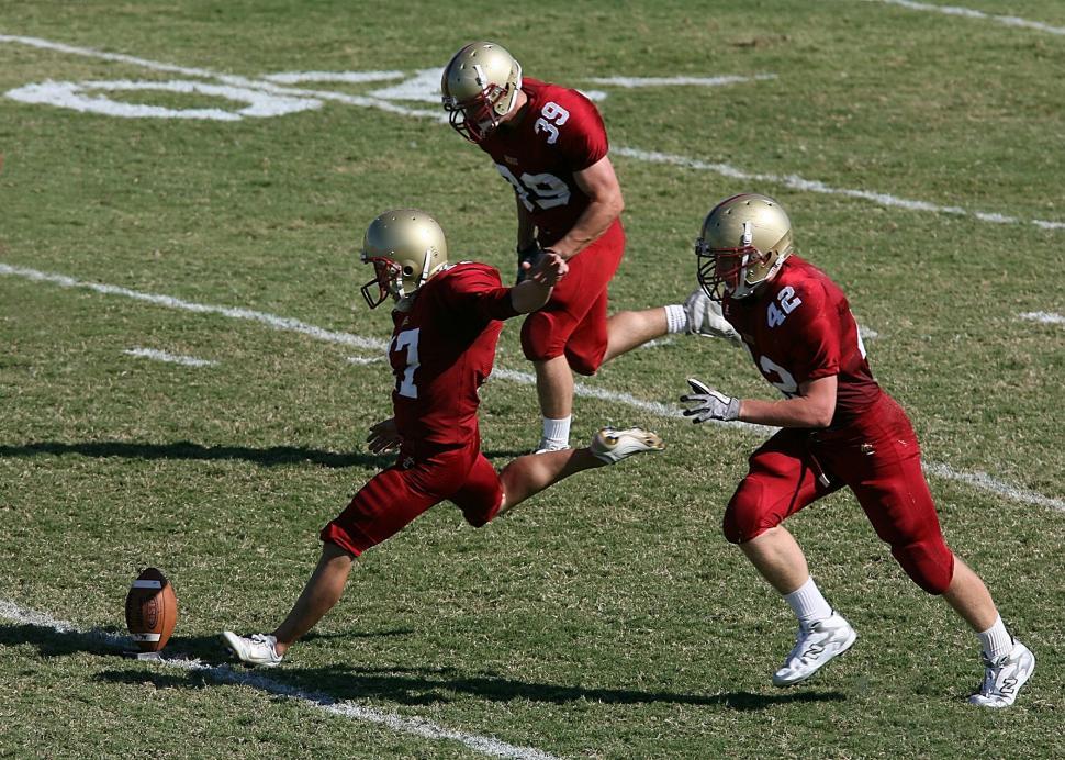 Free Image of Group of Men Engaged in Football Game 