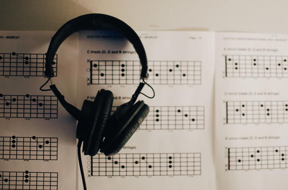 Free Image of Headphones on Book 