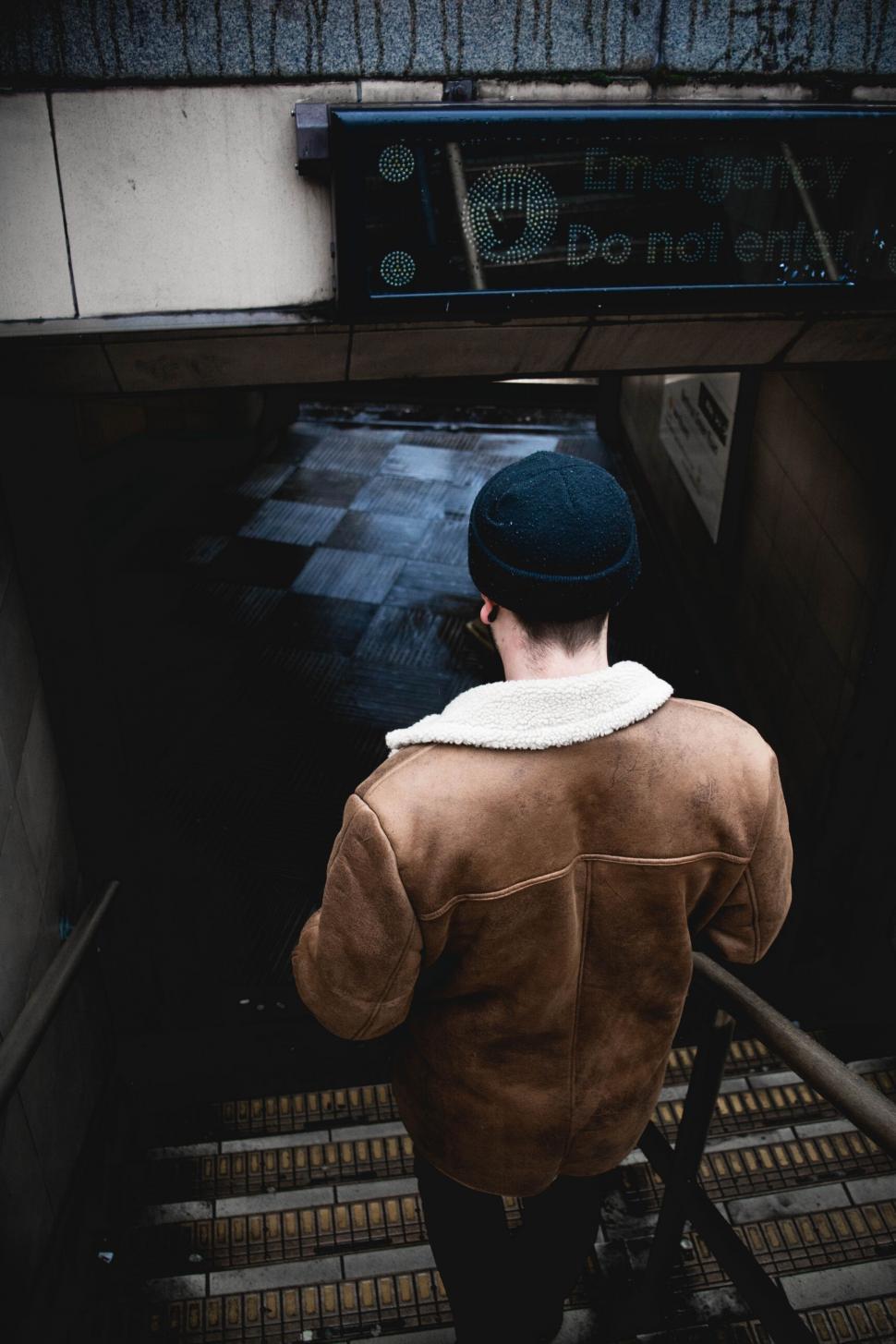 Free Image of Man Walking Up a Flight of Stairs 