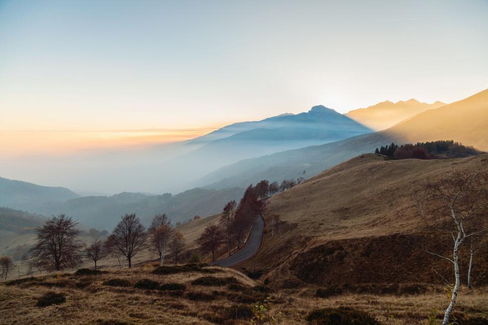 Free Image of Majestic Mountain Range With Trees in Background 