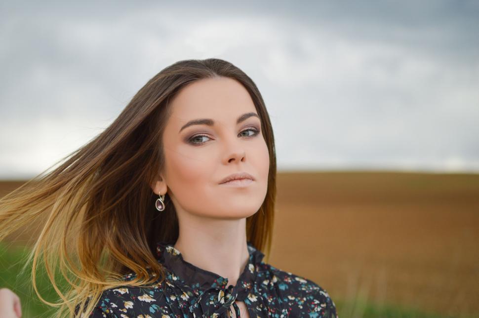 Free Image of Woman Standing in a Field 
