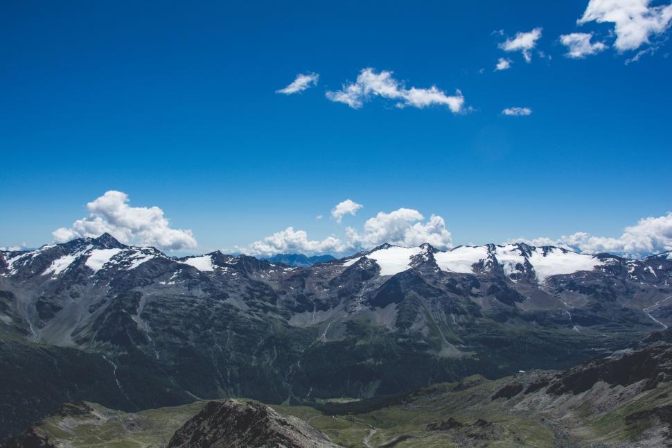 Free Image of Snow Capped Mountains in a Distant Mountain Range 