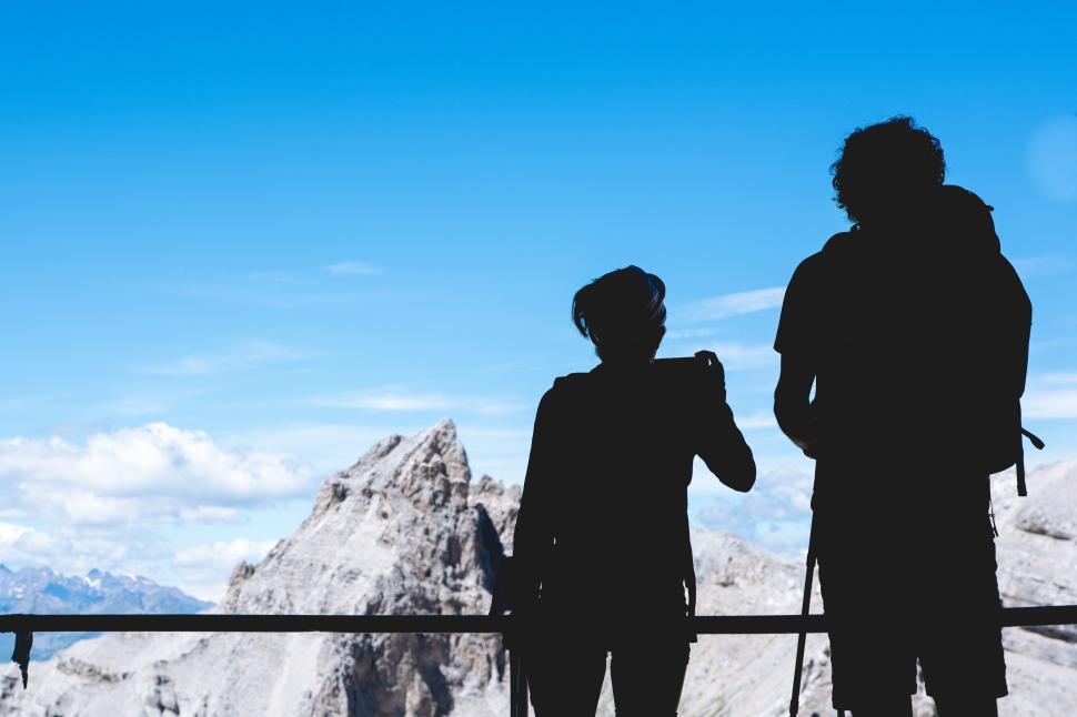 Free Image of Couple Standing on Snow Covered Slope 