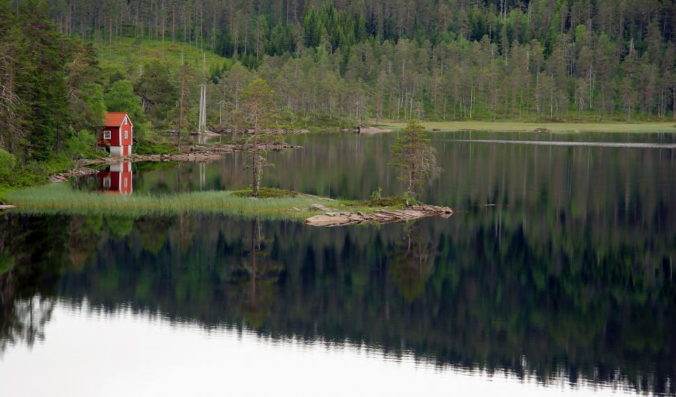Free Image of Small Red House on Lake Shore 