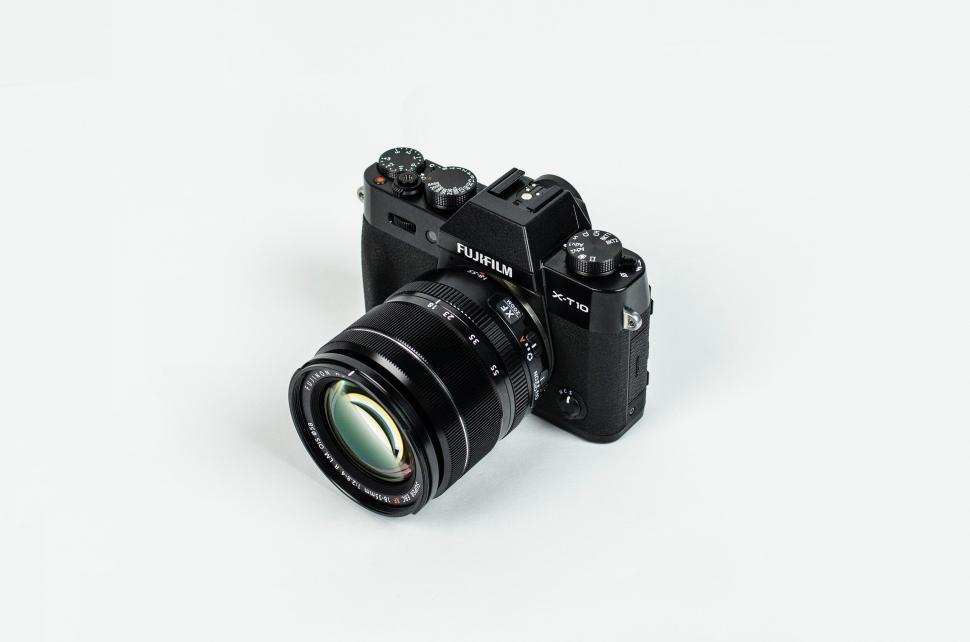 Free Image of Camera on White Surface 