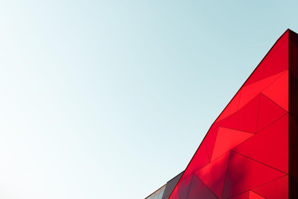 Free Image of Tall Red Building Against Sky 
