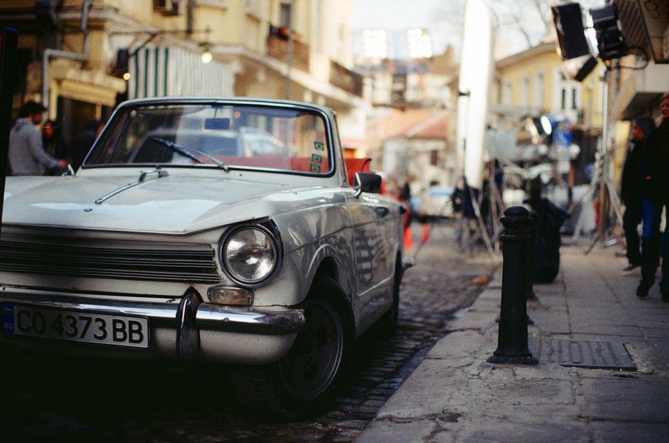 Free Image of Old Car Parked on Side of Street 